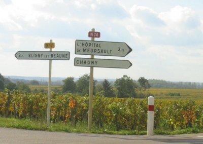 Road sign, each village famous for wine.
